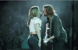  ?? CLAY ENOS — WARNER BROS. PICTURES VIA AP Photos and text from wire services ?? This image released by Warner Bros. Pictures shows Lady Gaga, left, and Bradley Cooper in a scene from “A Star is Born.”