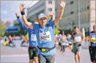  ??  ?? Jin running in the 2013 Berlin Marathon.