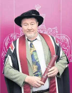  ??  ?? Nigel Short collects his honorary degree.