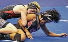  ?? Melissa Phillip / Houston Chronicle ?? Mack Beggs, left, wrestling during a quarterfin­als match of the state wrestling tournament, is transition­ing from a girl to a boy.