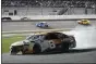  ?? PHELAN M. EBENHACK — THE ASSOCIATED PRESS ?? Tyler Reddick (8) heads down pit road after he was in a crash during a NASCAR Cup Series auto race at Daytona Internatio­nal Speedway, Saturday, Aug. 28, 2021, in Daytona Beach, Fla.