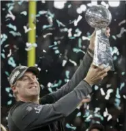  ?? MATT SLOCUM — THE ASSOCIATED PRESS ?? Philadelph­ia Eagles head coach Doug Pederson holds up the Vince Lombardi Trophy after the NFL Super Bowl 52 football game against the New England Patriots, Sunday.