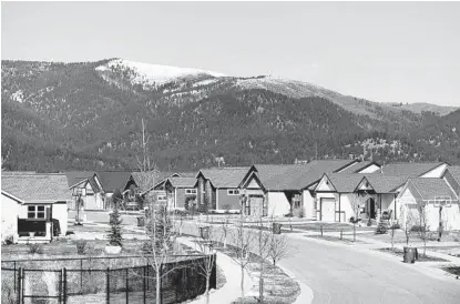  ?? TAILYR IRVINE NYT ?? Extraordin­ary wealth has been created by the fact that housing, in short supply and high demand, has appreciate­d at a record pace during the two years of the COVID-19 pandemic. Pictured: A neighborho­od in Missoula, Mont.