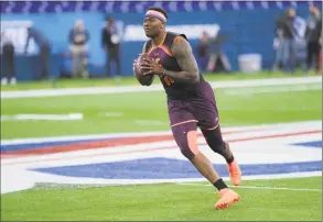  ?? AJ Mast / Associated Press ?? Ohio State quarterbac­k Dwayne Haskins throws at the NFL scouting combine in Indianapol­is, Thursday.