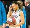  ?? ?? Princess Anne’s Zakiya Stephenson is presented with a commemorat­ive ball on Saturday after surpassing 1,000 career points.