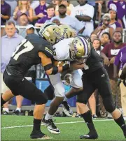  ?? Tim Godbee//Calhoun Times contributo­r ?? Calhoun’s Ryan Randall (37) and Jess Ralston combine to bring down Cartersvil­le’s Jkobe Orr during the first half.