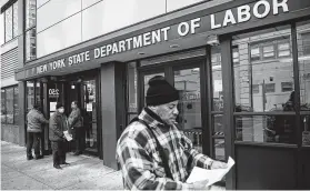  ?? John Minchillo / Associated Press ?? Experts predict next Thursday’s jobless report by the U.S. Labor Department will be even worse. Three weeks ago, before the pandemic spread in the U.S., barely 200,000 people applied for benefits.