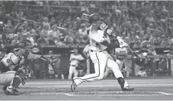  ??  ?? The Diamondbac­ks’ Carson Kelly connects for a three-run home run against the Orioles in the fourth inning at Chase Field in Phoenix on Wednesday afternoon. ROB SCHUMACHER/THE REPUBLIC