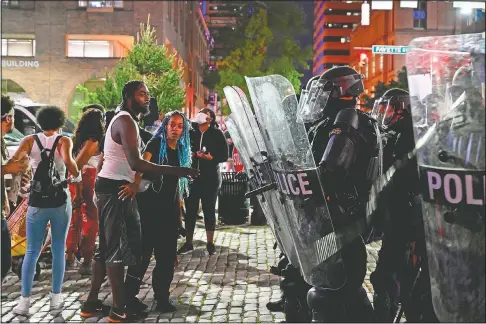  ?? (The Baltimore Sun/Jerry Jackson) ?? Demonstrat­ors protest George Floyd’s killing on May 30 in Baltimore.