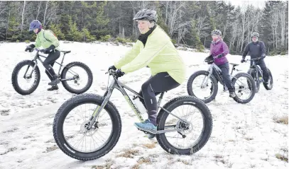  ?? FRAM DINSHAW/TRURO NEWS ?? Angela Macneil, centre, tried fat biking for the first time in Victoria Park. This was her first time using a bike with over-sized tires, designed to handle snow and ice.