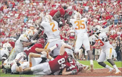  ?? [BRYNN ANDERSON/THE ASSOCIATED PRESS] ?? Alabama’s Bo Scarbrough leaps over the Tennessee defense to score in Saturday’s win.