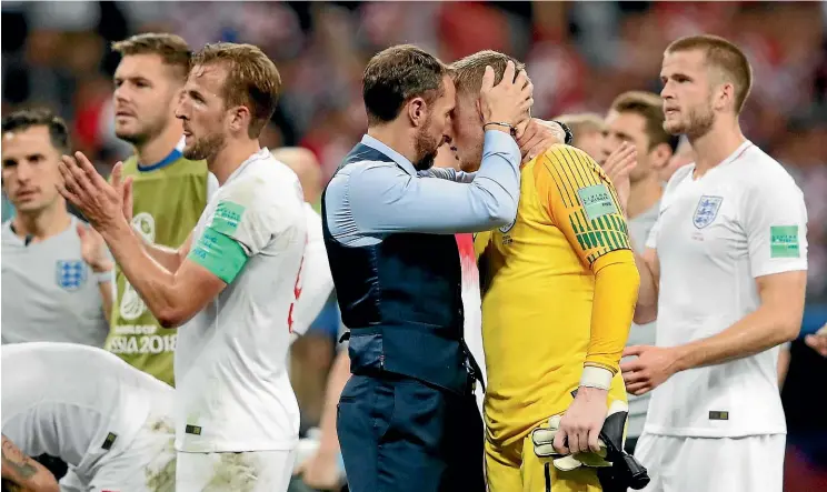  ?? AP ?? Gareth Southgate consoles England goalkeeper Jordan Pickford at the end of the World Cup semifinal loss Croatia in Moscow yesterday.