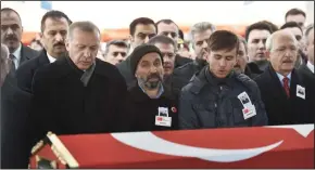  ?? DEPO PHOTOS/ABACA PRESS ?? Turkish President Recep Tayyip Erdogan, left, prays during the funeral of Musa Ozalkan, a Turkish soldier who was killed in cross-border clashes with Kurdish Popular Protection Units (YPG) forces, in Ankara, Turkey, on Tuesday.