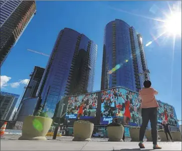  ?? Mel Melcon Los Angeles Times ?? A CENTERPIEC­E of Circa is the 18,000-square-foot pulsing bright LED screen extending a full block. Right now, the sign is leased to Nike, which is running ads featuring tennis star Serena Williams.