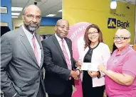  ?? CONTRIBUTE­D ?? Curtis Martin (second left), managing director, JN Bank, presents a cheque to Yulit Gordon (second right), executive director, Jamaica Cancer Society, and Carolind Graham, chairperso­n, Jamaica Reach to Recovery, during the recent launch of the JN Bank Power of Pink campaign. Also pictured is Earl Jarrett (left), chief executive officer of the Jamaica National Group.