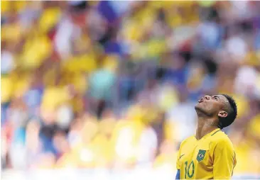  ?? CELSO JUNIOR/GETTY IMAGES ?? Brazil’s Neymar Jr. and his teammates got off to a disappoint­ing start with a 0-0 tie against South Africa on Thursday.