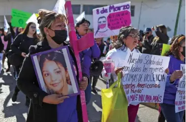  ?? HERIKA MARTINEZ/AFP/GETTY IMAGES/TNS ?? Activists and mothers of the female victims of disappeara­nce, traffickin­g, and femicide protest March 8 next to the Cruz de Clavos in Ciudad Juarez, Mexico.