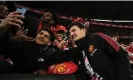  ?? James Ross/EPA ?? Manchester United’s Harry Maguire with fans at Melbourne Cricket Ground. Photograph: