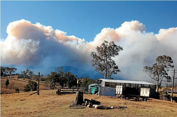  ?? FAIRFAX ?? An out-of-control fire burns in national park land at Bemboka, New South Wales.