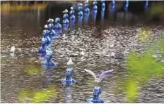  ?? AP ?? On a wing and a prayer Seagull stand on the artwork ‘Where the Tides Ebb and Flow’ by Argentinia­n artist Pedro Marzorati installed in a pond at the Montsouris park in Paris yesterday.