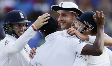  ??  ?? A belter: Chris Jordan is mobbed by England team-mates after catching Kraigg Brathwaite