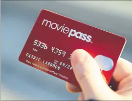  ?? DARRON CUMMINGS — THE ASSOCIATED PRESS ?? A MoviePass credit card allows subscriber­s to gain entry to movies for one flat monthly fee.