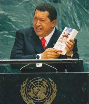  ??  ?? HE NEEDS a larger reading list. Venezuelan president Hugo Chavez holds up author Noam Chomsky’s book ‘Hegemony or Survival: America’s Quest for Global Dominance’ as he addresses the 61st General Assembly of the United Nations at UN headquarte­rs in New...
