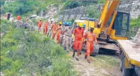  ??  ?? NDRF officials carry out rescue work after a massive landslide two days ago at Negulsari Reckong-peo -Shimla NH in Kinnaur district on Friday.