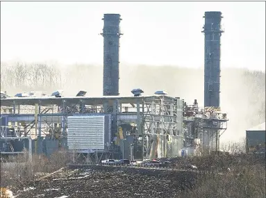  ?? Catherine Avalone / Hearst Connecticu­t Media file photo ?? Smoke comes from the the Kleen Energy plant on River Road in Middletown in February 2010. Five workers were killed and a sixth died later from burns. The explosion was caused by the use of natural gas to clean pipes at the plant a practice has since been determined to be unsafe. Below, crews work to knock down a fire in Lawrence, Mass. on Thursday.