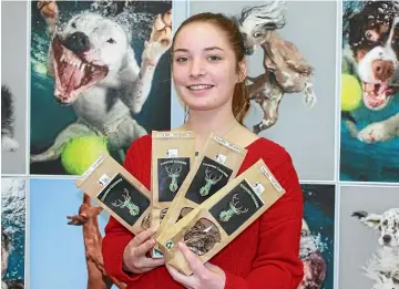 ?? KRIS BOULT/STUFF ?? Tenneile CrumpConch­ie, 18, shows off the Country Canine pet food which she makes herself.