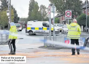  ??  ?? Police at the scene of the crash in Droylsden