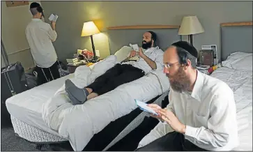  ?? Pictures: KEVIN SUTHERLAND ?? HOLY INN: Breslov Hassid members busy with religious studies at their Gauteng hotel this week