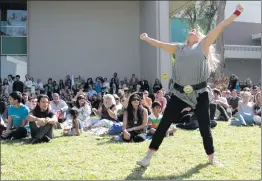  ?? Nikolas Samuels/The Signal ?? Students and alumni of the The Sharon Disney Lund School of Dance break out into a flash mob on Friday.