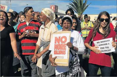  ?? Picture: LEE-ANNE BUTLER ?? SO FED UP: Hundreds of people gathered along Stanford Road in Port Elizabeth yesterday to stand up against the increase in crime and gangsteris­m in the northern areas as part of the ‘Hands across Stanford Road: Enough is Enough’ campaign