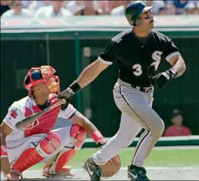  ??  ?? In this 1996 file photo, Chicago White Sox’s Harold Baines (3) watches his ninth inning solo home run head for the center field seats during the White Sox’s 3-2 win over the Cleveland Indians in Cleveland. AP PhoTo/JEff GlIDDEn