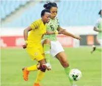  ??  ?? Super Falcons’ Onome Ebi (right) fights for the ball with a South African player during the final of the 2018 African Women Cup of Nations in Accra, Ghana