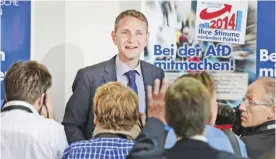  ?? — AFP ?? BERLIN: This file photo taken on September 15, 2014 shows the then Alternativ­e fuer Deutschlan­d (AfD) party’s main candidate in Thuringia Bjoern Hoecke (C) speaking at a press conference in Berlin, following regional elections in the German states of...