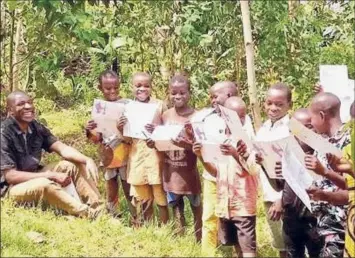  ?? Baker Public Relations ?? Children in Burundi enjoy notes developed by Ashley Campbell from Saratoga Springs. She donated the cards with the “thank you very much” translated into Kirundi.