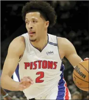  ?? AARON GASH — THE ASSOCIATED PRESS ?? Detroit Pistons’ Cade Cunningham drives to the basket in Monday’s win over the Milwaukee Bucks. The rookie is averaging 15.4 points and 6.2 rebounds a game this season.