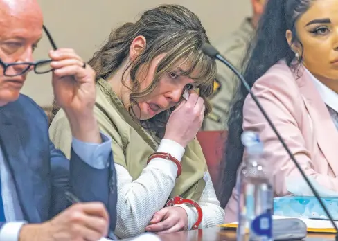  ?? LUIS SÁNCHEZ SATURNO/THE NEW MEXICAN ?? Former Rust armorer Hannah Gutierrez-Reed wipes tears at her sentencing Monday in First Judicial District Court. “I beg you, please don’t give me more time,” she said to District Judge Mary Marlowe Sommer, who later sentenced her to the maximum 18 months for involuntar­y manslaught­er.