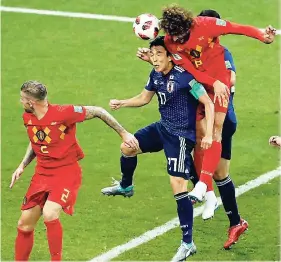  ??  ?? Belgium’s Marouane Fellaini (right) scores his team’s second goal during the round of 16 match between Belgium and Japan at the 2018 World Cup.