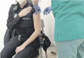  ??  ?? A National Police officer received her first jab this week