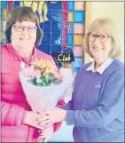  ?? ?? Marie Reidy, runner-up in the Nancy Doyle Trophy competitio­n accepting her prize from Margaret Costello, convenor of the senior ladies.