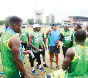  ??  ?? South African Cricket Legend, Makhaya Ntini the new Technical Consultant to the National Cricket Team, having a chat with the team members after a training session at the Tafawa Balewa Square, Cricket Ova