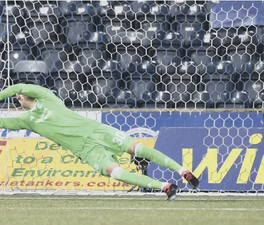  ?? PICTURE: CRAIG WILLIAMSON/SNS ?? Eamonn Brophy to put the away side ahead in the penalty shoot-out at Rugby Park last night.