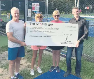  ??  ?? Noel Benstead of Tremains (right) presenting the $500 cheque to Ōmokoroa Tennis Club. PHOTO: Supplied.