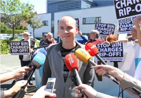  ??  ?? Protest against bin charge rip-off at South Dublin County Council, Tallaght. Pictured is Paul Murphy TD taking to the media with protesters from AAA Aliance and members of the public as Simon Coveney visits SDCC. They demand of Reverse bin charges hike...