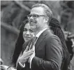  ?? Susan Walsh / Associated Press ?? Dr. Patrick Jackson gestures during the event Friday celebratin­g his wife. Beside him is their daughter, Leila.