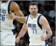  ?? MATT YORK — THE ASSOCIATED PRESS ?? Dallas Mavericks guard Luka Doncic (77) celebrates a basket against the Phoenix Suns during the first half of Game 7of an NBA basketball Western Conference playoff semifinal, Sunday, May 15, 2022, in Phoenix.