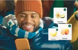  ?? COURTESY ?? A commercial for Instacart shows a man simultaneo­usly watching a football game and shopping for groceries online.